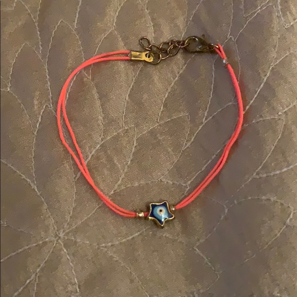 Pink bracelet with star charm